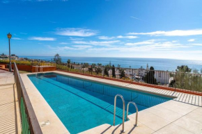 Adosado con vistas al mar desde la piscina con BBQ